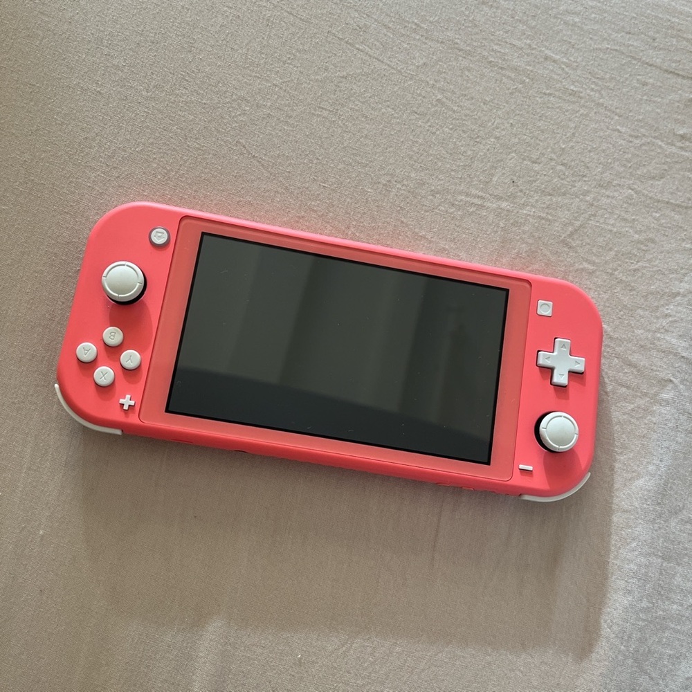 Nintendo switch lite in coral